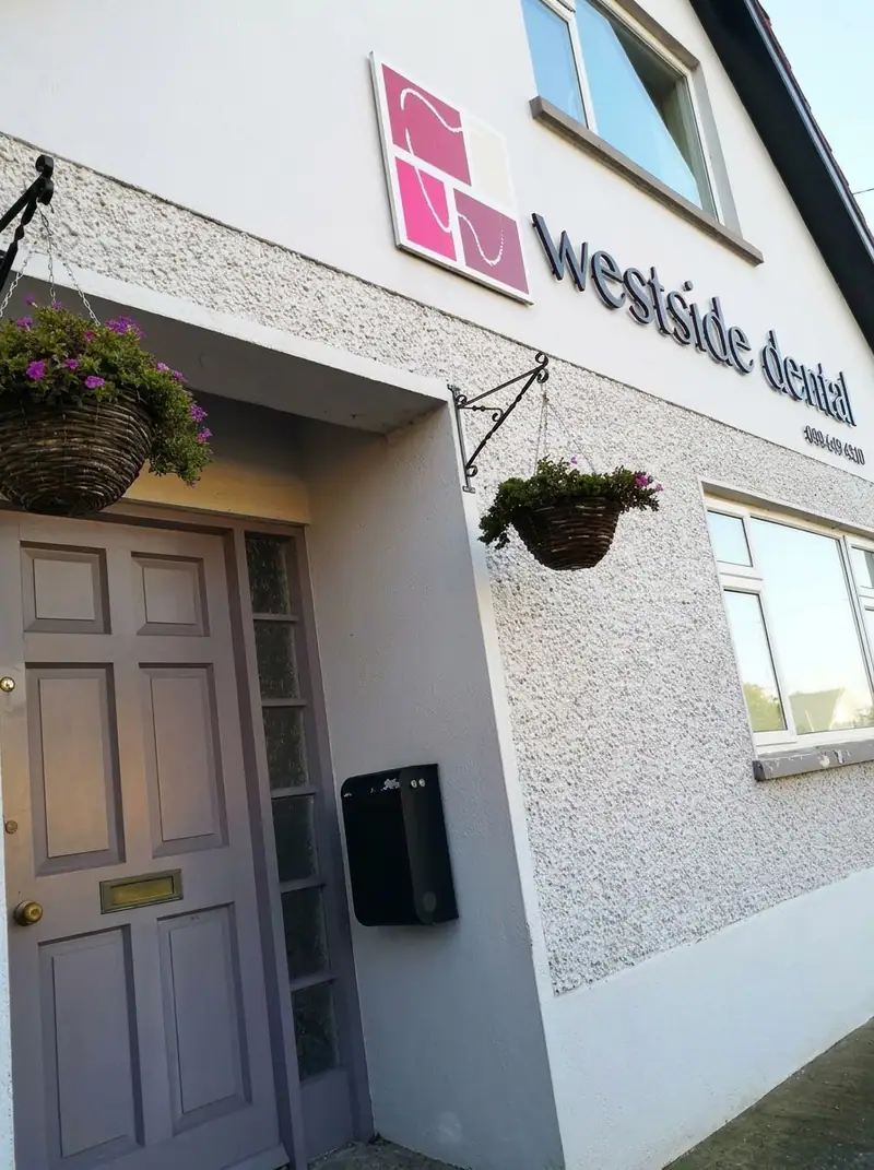 The front door and Westside Dental sign